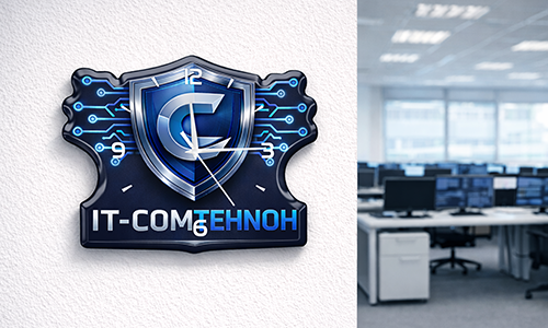 Reloj de pared de oficina con logo shield IT-COMTEHNOH y diseño de circuito, con estaciones de trabajo visibles en el fondo