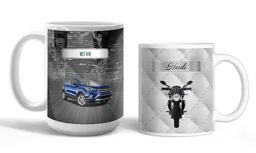 Two white mugs with vehicle-themed prints: blue SUV with city lights, motorcycle with quilted silver background and name Heidi