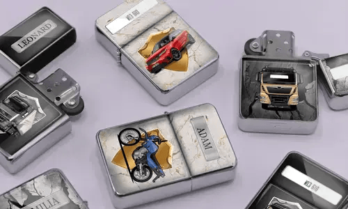 A variety of metal lighters lie on a soft purple surface, featuring personalized designs of cars, motorcycles, and trucks, each marked with different names.