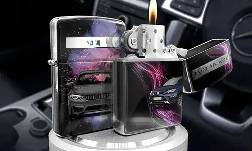 Set of metallic lighters with luxury car designs: one open with flame, others with purple light streaks, placed inside car interior