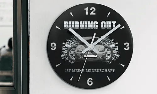 Wall clock with motorcycle and engine graphics, BURNING OUT IST MEINE LEIDENSCHAFT text on black face
