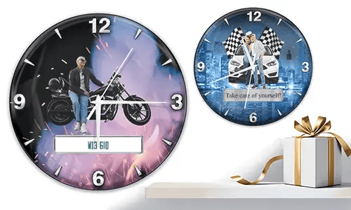 Two wall clocks with vehicle scenes: left with motorcycle and purple-orange glow, right with white cars and racing flags on blue background