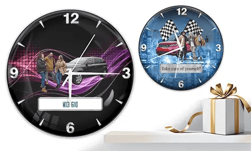 Two wall clocks with group car scenes: left with black car and purple waves, right with red and black cars, racing flags, and blue background