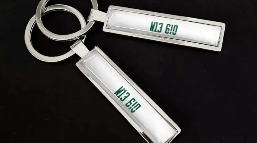 Custom license plate keychains with metal finish and personalized number design