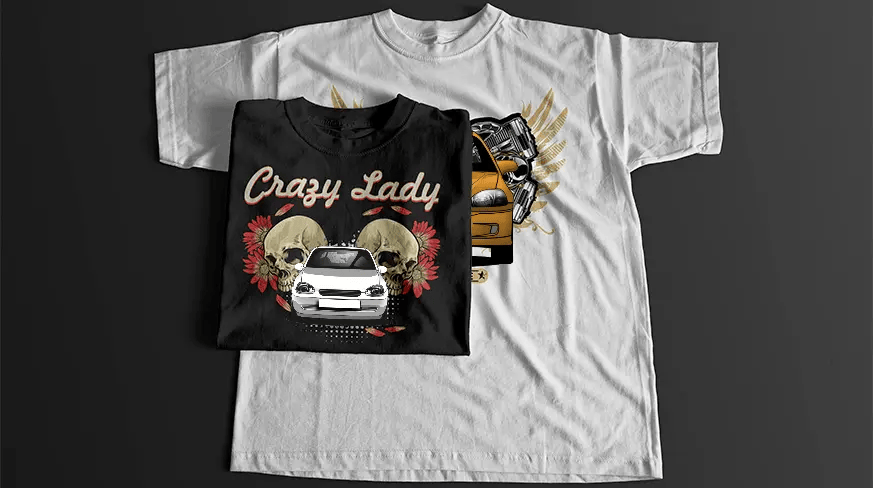 Black T-shirt with stylized car front, skulls, engine parts, golden wings, and BORN TO DRIVE banner